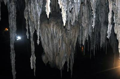 Stalactites hung down from the ceiling of the cave 